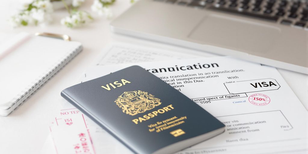 Visa documents and translation tools are on the desk.